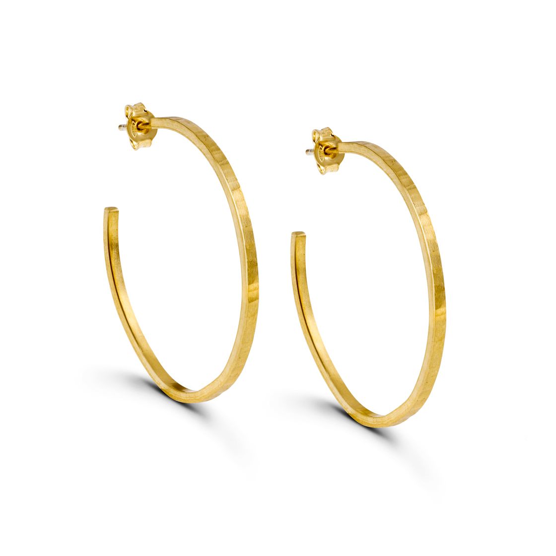 Gold hoop earrings with square edges offer a modern twist to a classic style.