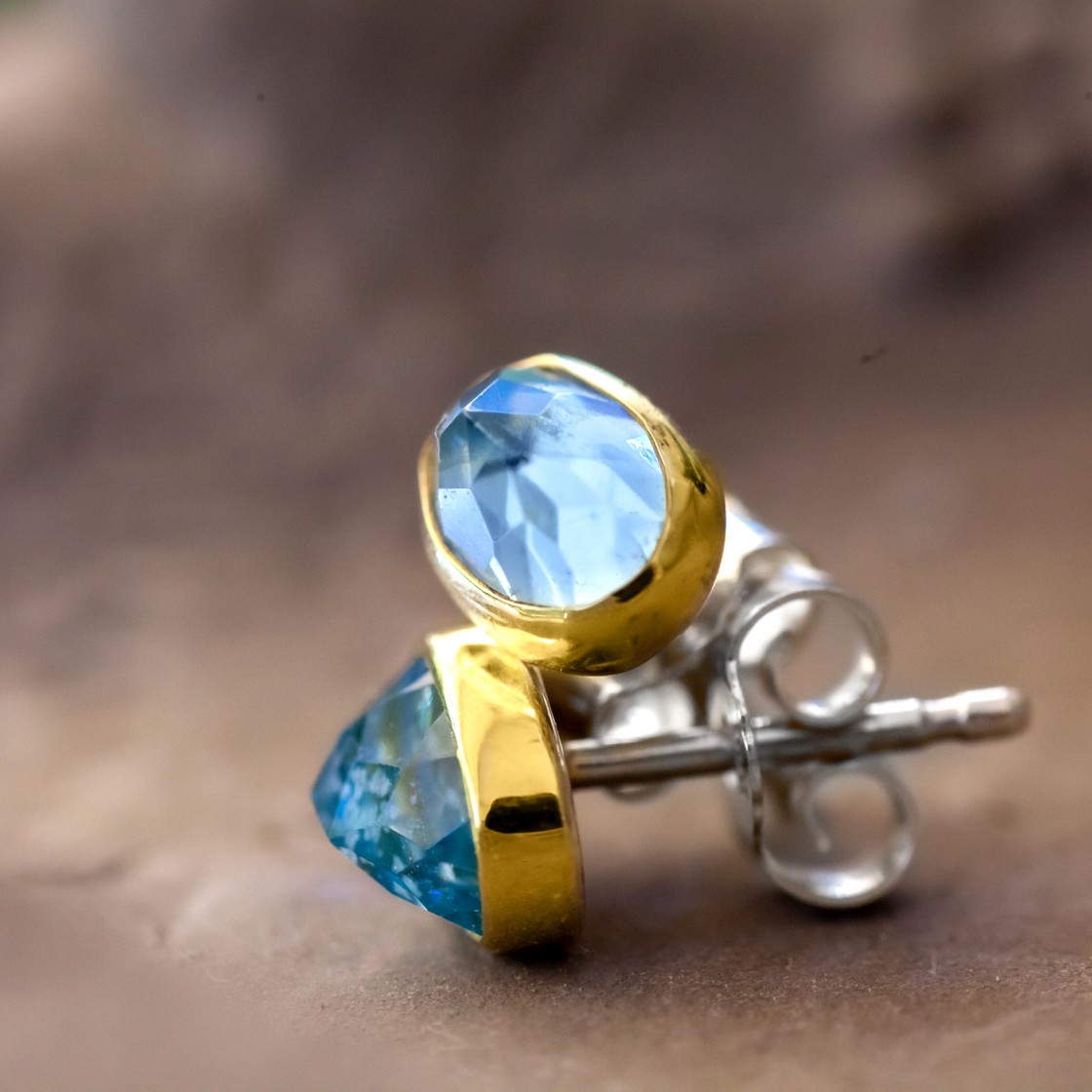 18kt gold bezels trace the shape of these beautiful oval aquamarine  stones with sterling silver backings