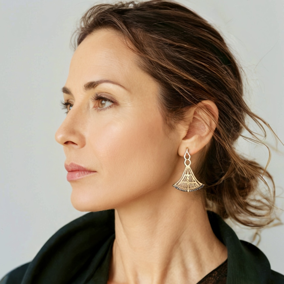 Lotus Flowers, based on a jug drawing from Agia Triada and Palaikastro, 1500-1450 B.C. With the techniques of engraving and repousse this pair of earrings highlights its uniqueness.