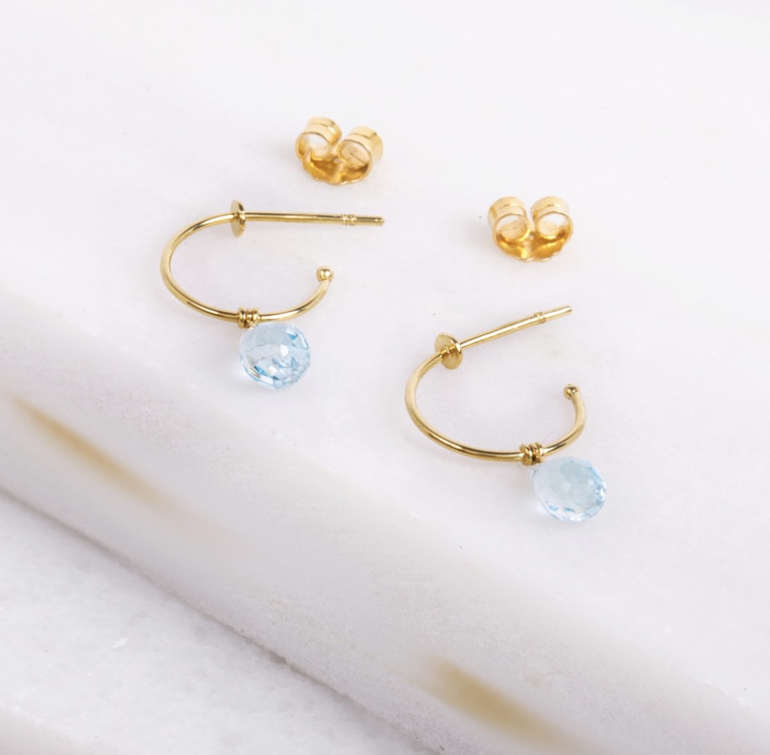 Little gold hoops with a drop cut aquamarine stone.