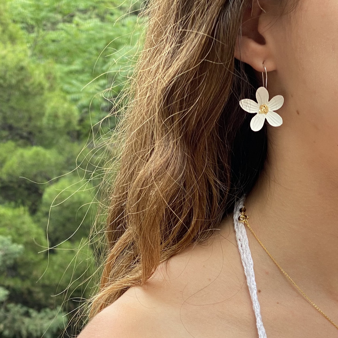 White daisy flowers with gold center dangle earrings. Handpainted with natural pigments, with a velvet finish.