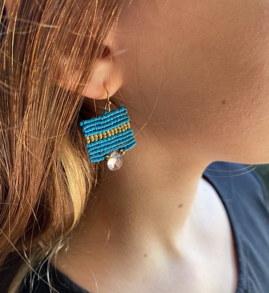 Handcrafted teal and gold, macrame, dangle Earrings with rose-quartz stones. Simultaneously modern and summery, these unique earrings will add a bohemian touch to your outfit.