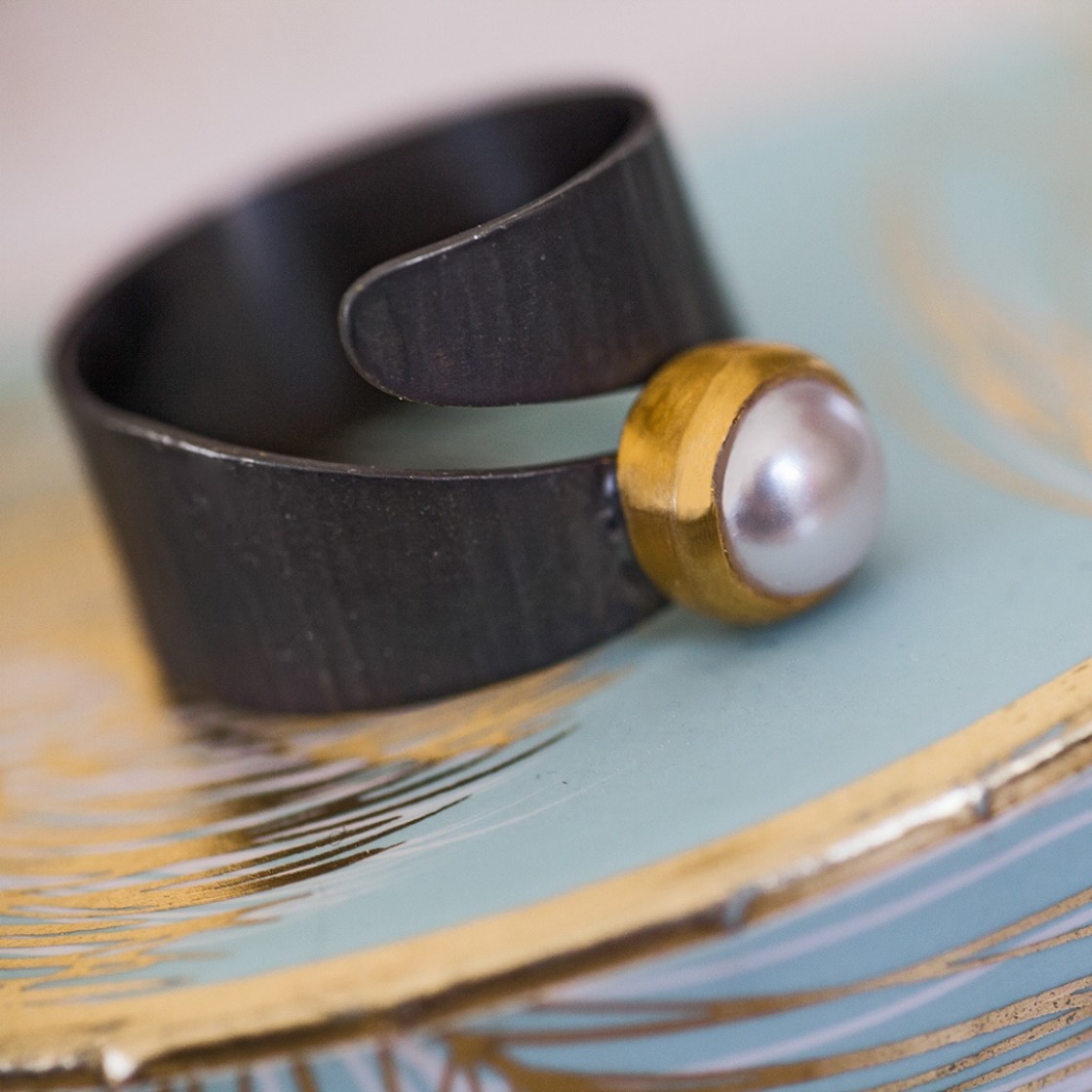 Double wrap-around ring with a gold handmade bezel set fresh water pearl.