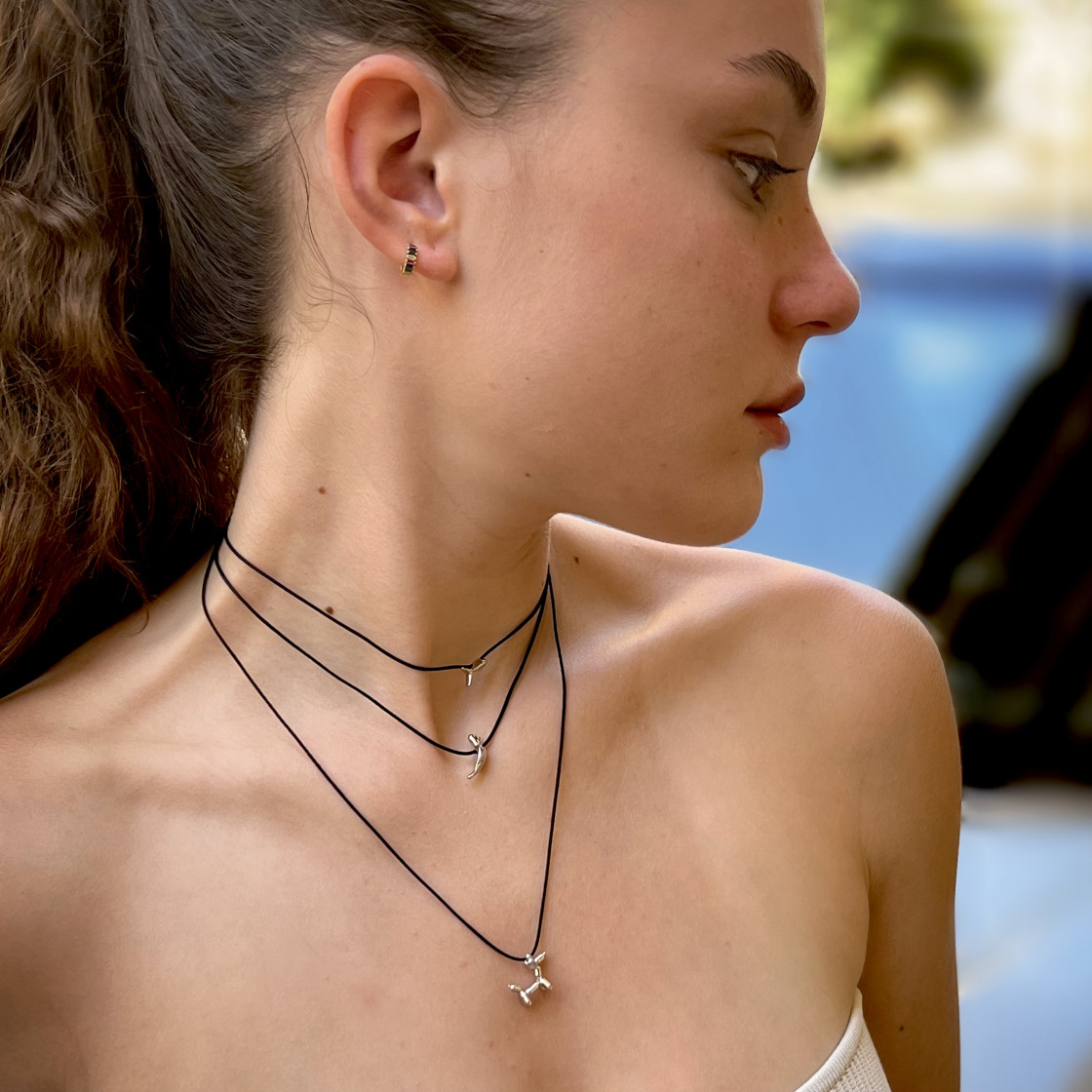 A little silver bird-pendant that symbolises freedom and spirituality