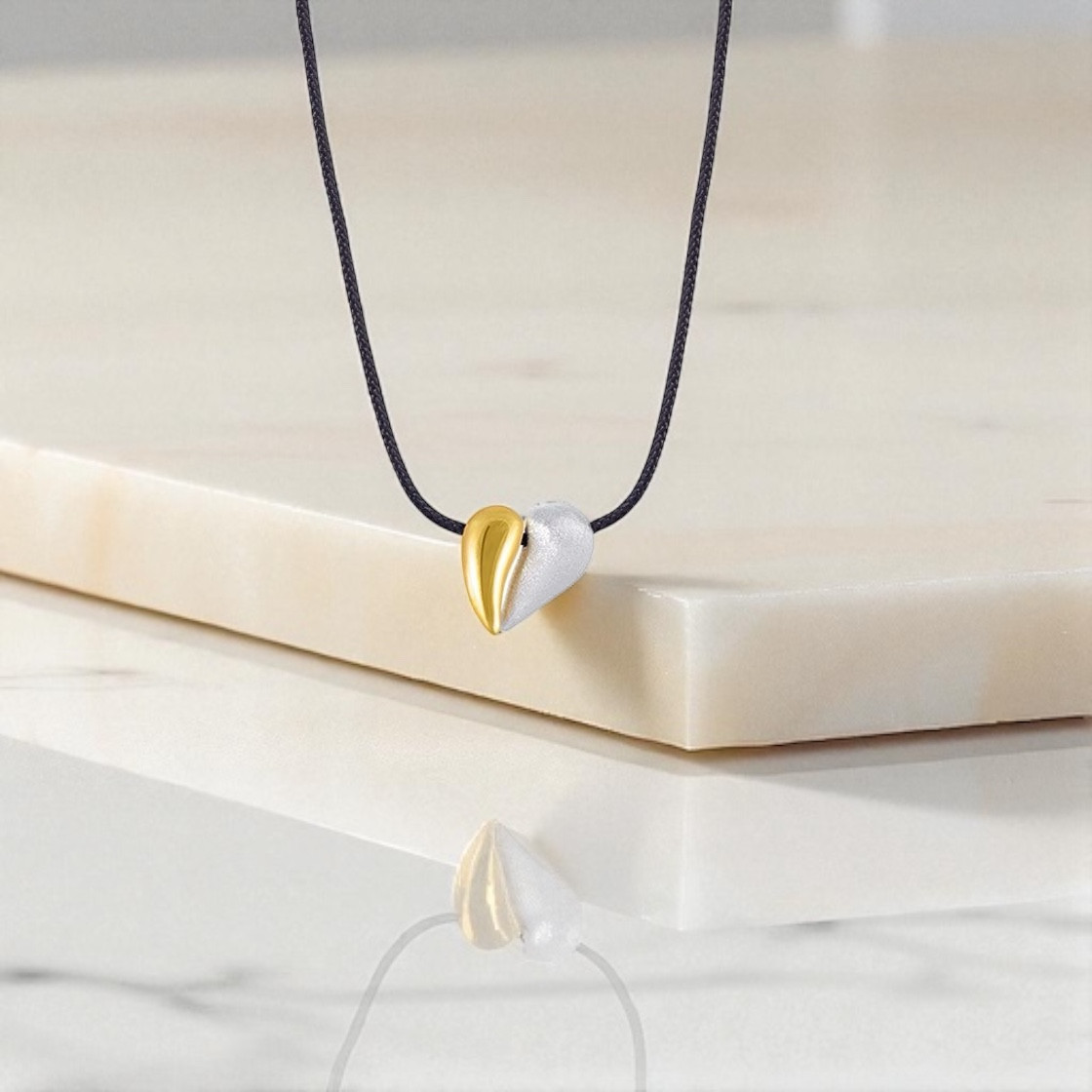 Heart pendant that is created when two drops meet