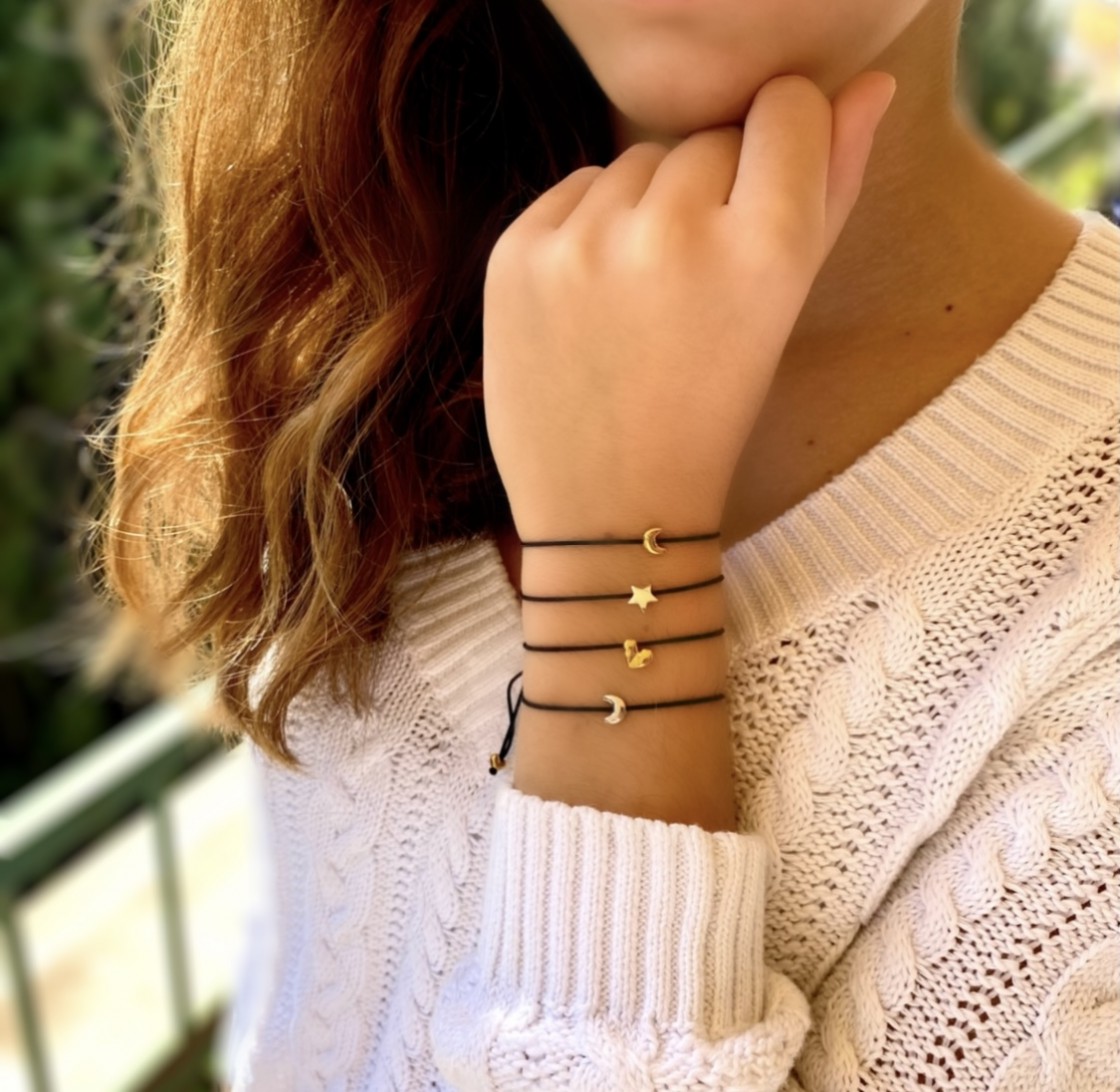 Little quarter moon bracelet, on an adjustable black cord