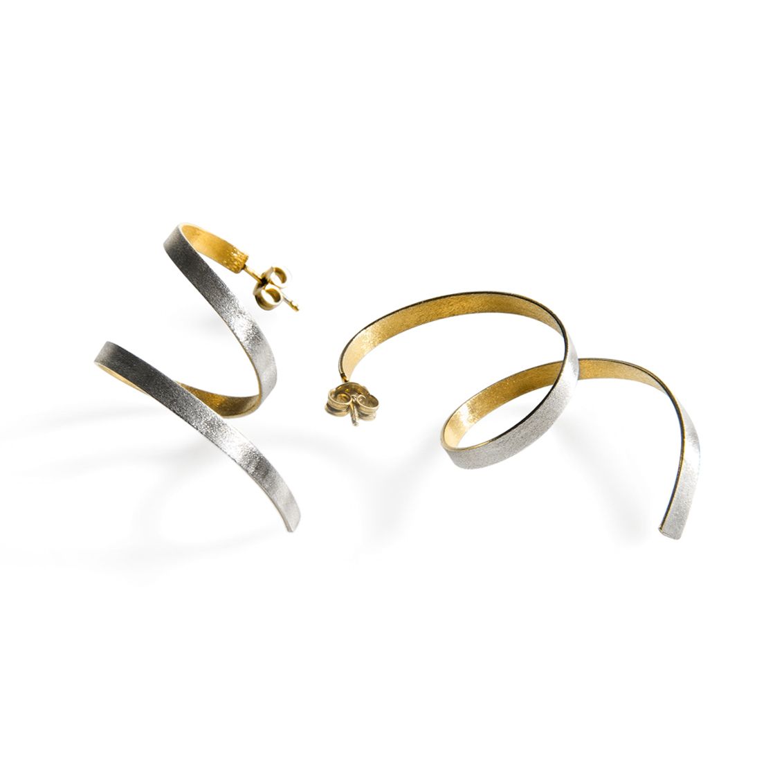Elegant coil earrings strike the perfect balance between gold and silver.