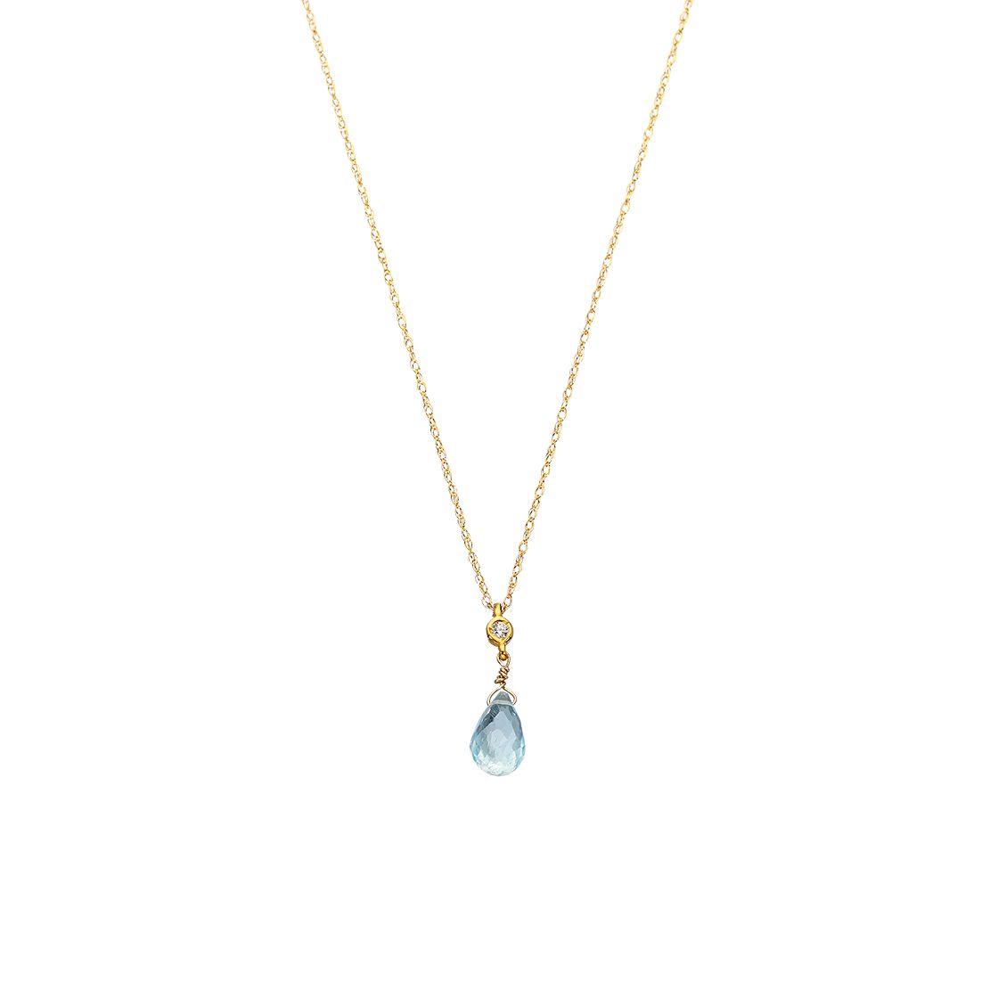 Gold set zircon stone and teardrop aquamarine charm necklace on a delicate gold chain.