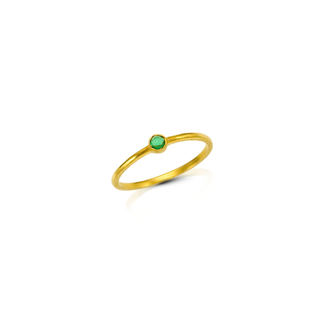 Simple gold band with green zircon stone.