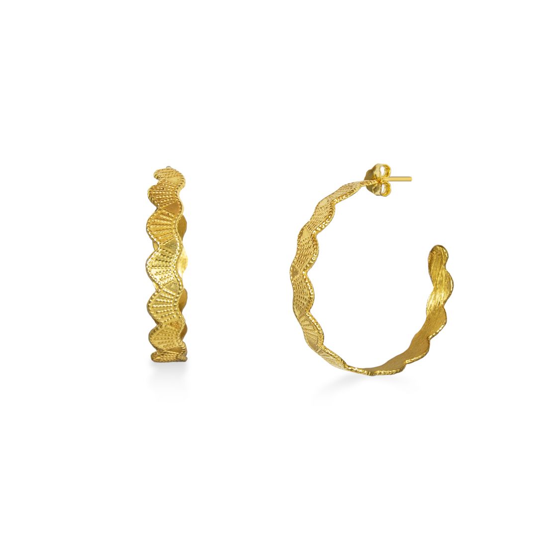 Outstanding Handmade hoops with wavy sides. With the techniques of engraving and repousse this pair of earrings highlights its uniqueness