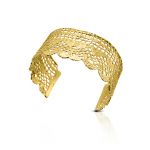 A charming gold-plated lace wide-cuff bracelet is a delicate addition for your special day.